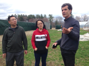 Dobson with researchers Dr. Jim Tang and his assistant at Equinox Farm.