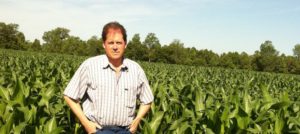 David Munson standing in a cornfield.
