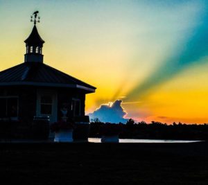 Main building at Potter's Settlement in the sunset