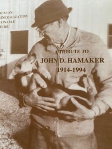 Magazine cover with photo of John Hamaker holding a dog